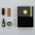 Beard care kit with beard oil, scissors, comb, and brush on a black box labeled '6Pcs'.